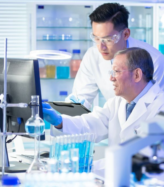 Image 4 - Two scientists reviewing data modeling on a computer in a lab