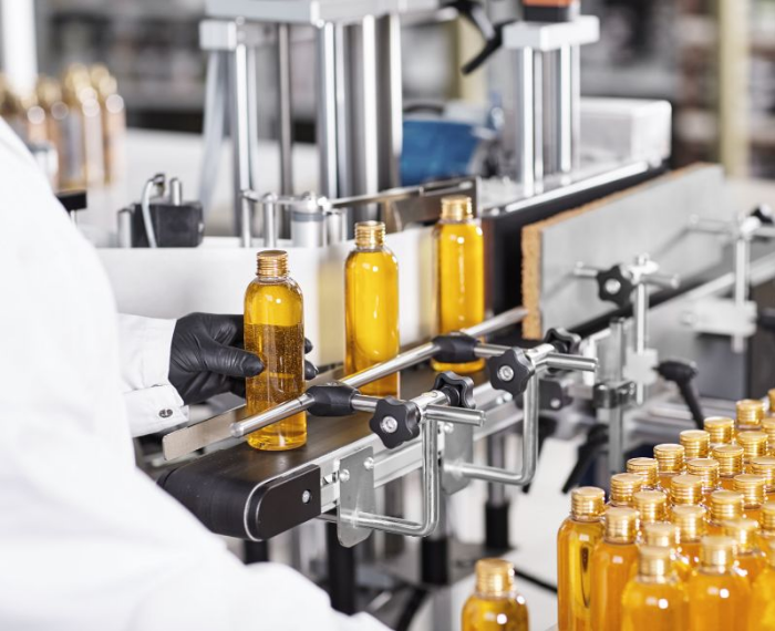 Bottles on conveyer belt factory chemical regulation