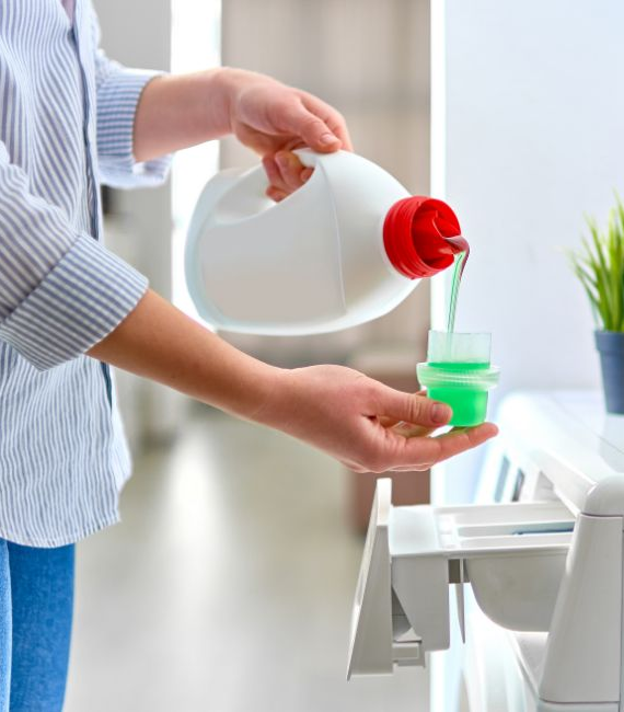 Person pouring laundry detergent environment health safety