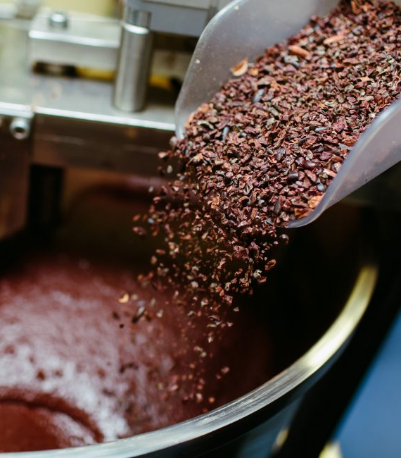 Trace One PLM raw materials being added to chocolate mixture