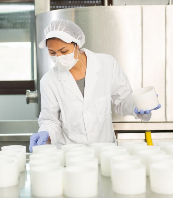 Selerant Compliance Cloud woman in lab or plant checks product quality
