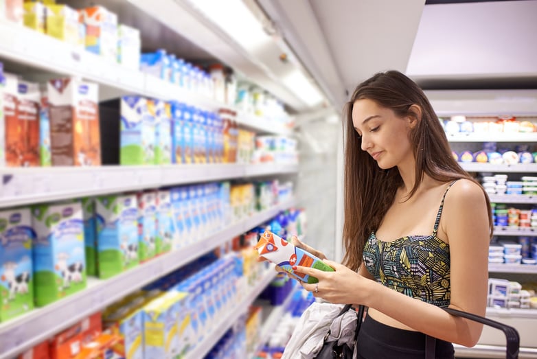 Young woman choosing a product in a store